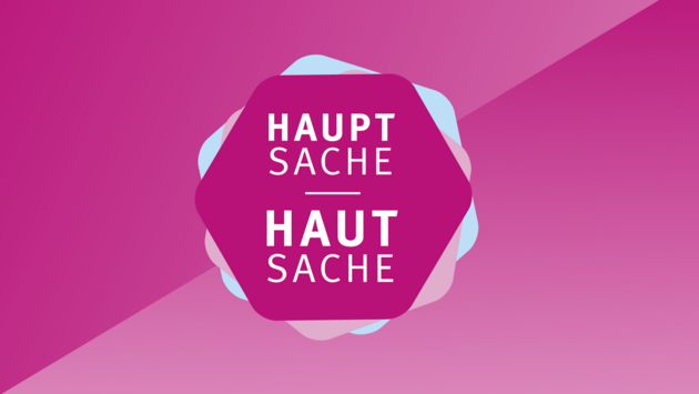 Logo des Programmjahrs 2021/2022 "Hauptsache Hautsache", magentafarbenes Sechseck